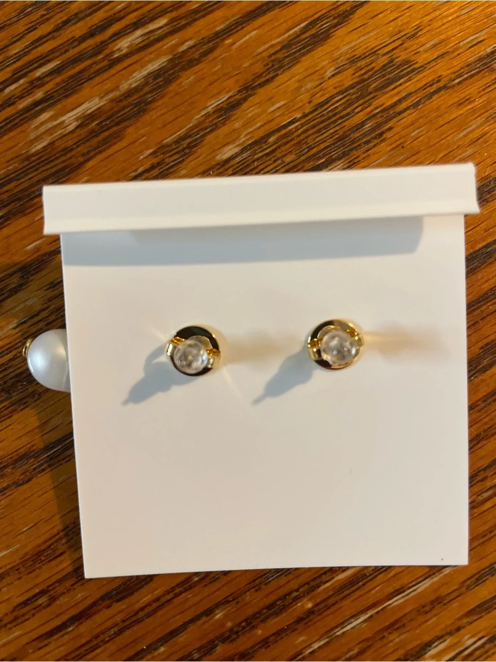 Brand new pearl-drop earrings by Tory Burch.